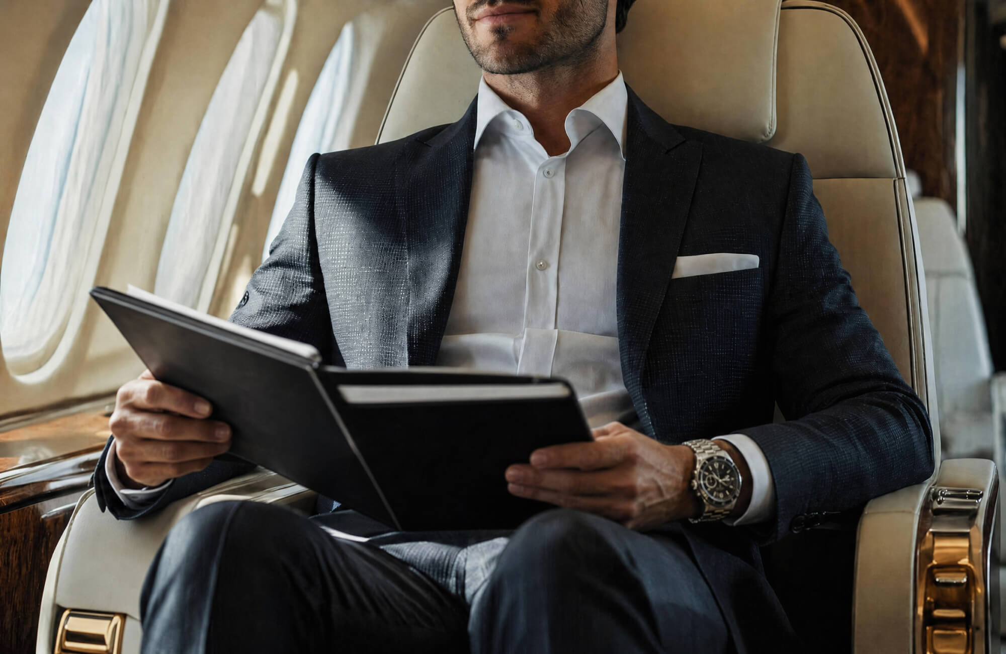 Adviser reviewing documents in a business jet cabin